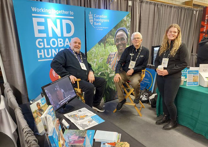 Foodgrains Bank volunteers working at display booth