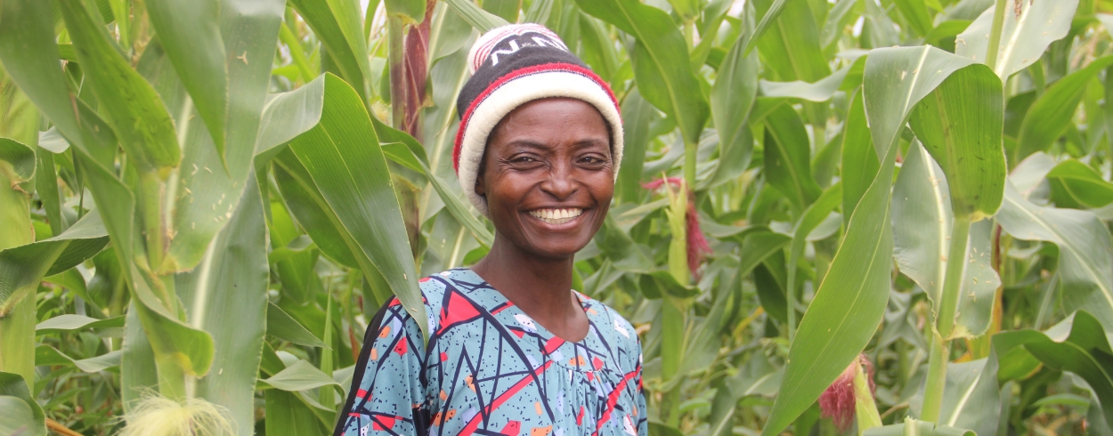 Americh standing in front of her field