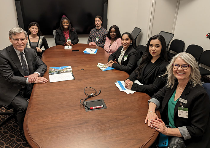 MP Terry Duguid with Patricia Sachirarwe, Anton Kats, Josepha Esemogie, Dorcus Yohan, Ivanna Romero, Charlene Wieler.